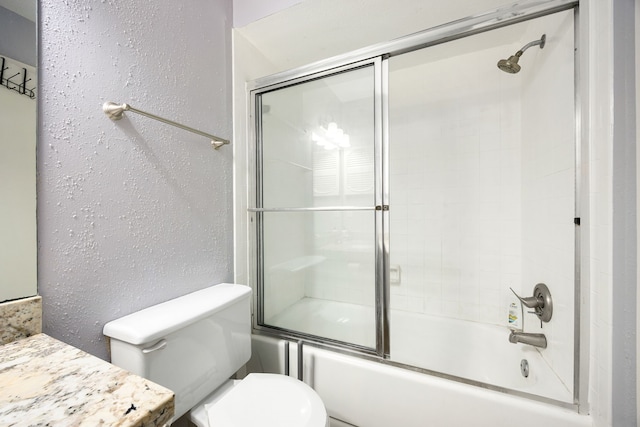 full bathroom with vanity, toilet, and enclosed tub / shower combo