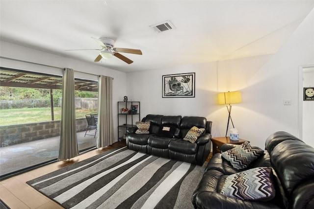 living room featuring hardwood / wood-style flooring and ceiling fan