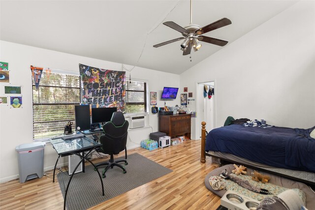 bedroom featuring ceiling fan, cooling unit, hardwood / wood-style floors, and vaulted ceiling