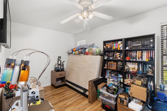 interior space featuring light wood-type flooring and ceiling fan