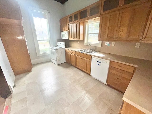 kitchen with sink and white appliances