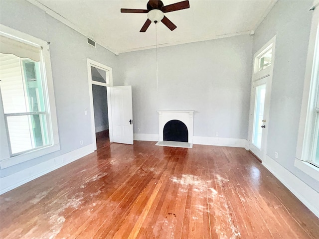 unfurnished living room featuring ceiling fan and hardwood / wood-style floors