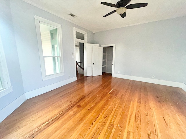 spare room featuring hardwood / wood-style flooring and ceiling fan