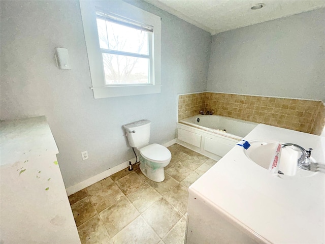 bathroom with sink, toilet, and a bathing tub