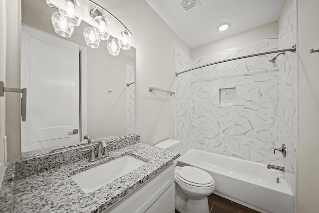 full bathroom featuring toilet, vanity, and tiled shower / bath