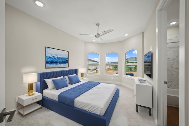 bedroom with light carpet and ceiling fan