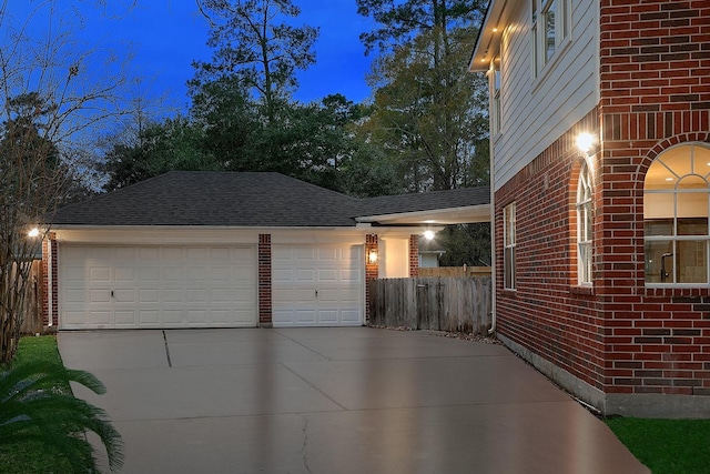 view of side of home featuring a garage