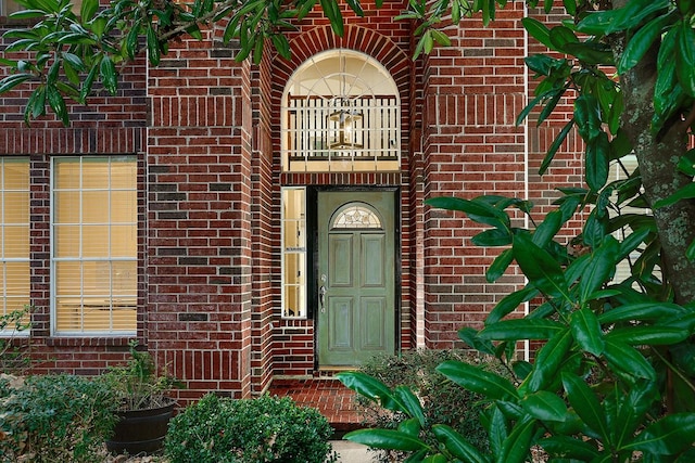 doorway to property featuring a balcony