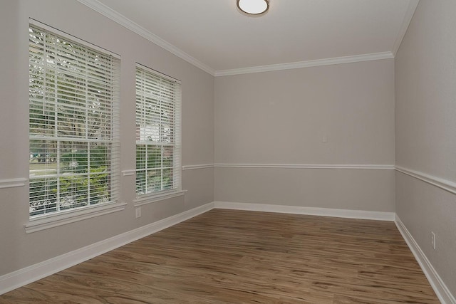 unfurnished room featuring dark hardwood / wood-style flooring and ornamental molding