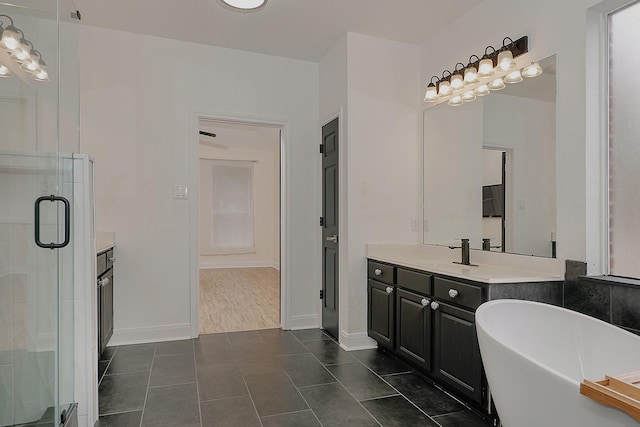 bathroom with independent shower and bath, tile patterned flooring, and vanity