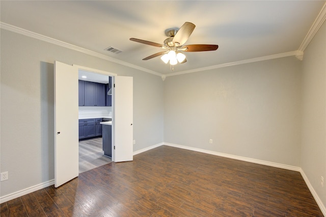 empty room with ceiling fan, ornamental molding, and dark wood-type flooring