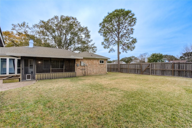 view of yard featuring a sunroom