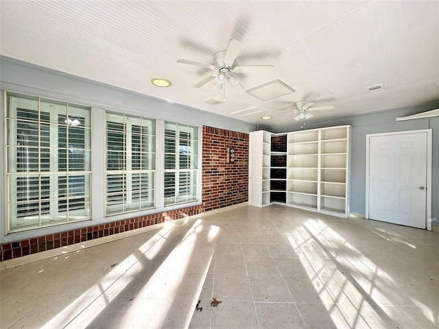 unfurnished living room featuring visible vents, a ceiling fan, and tile patterned floors