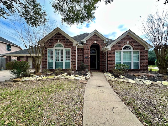 view of front of home featuring brick siding