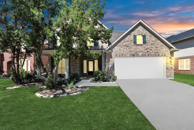 obstructed view of property with a garage and a yard