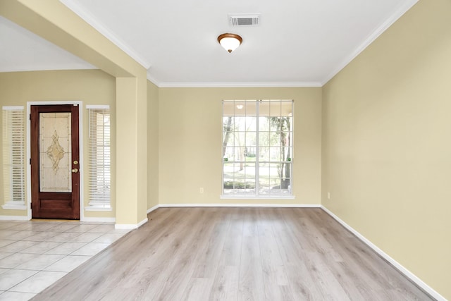 foyer featuring light hardwood / wood-style flooring and ornamental molding