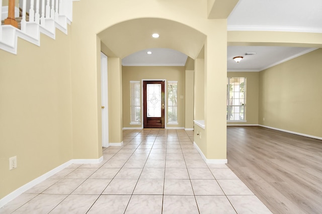 tiled entryway with ornamental molding