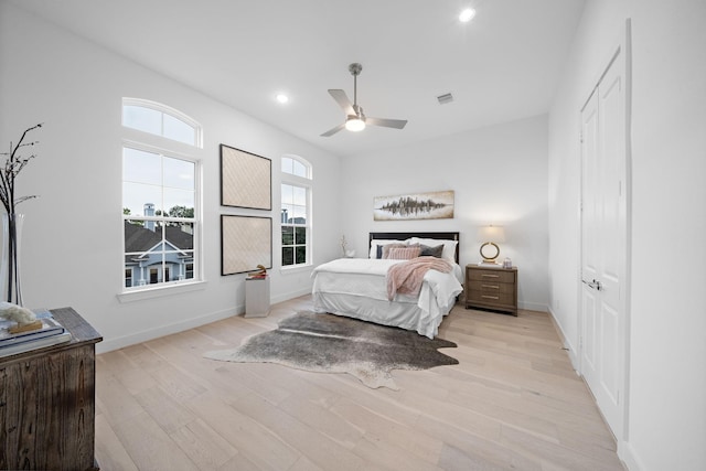 bedroom featuring ceiling fan and light hardwood / wood-style flooring