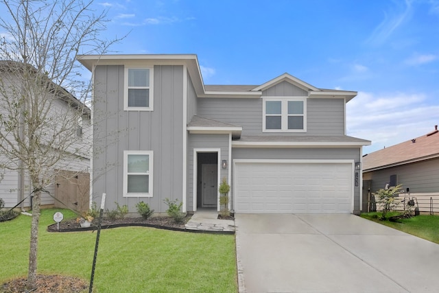 view of front of home with a garage and a front yard