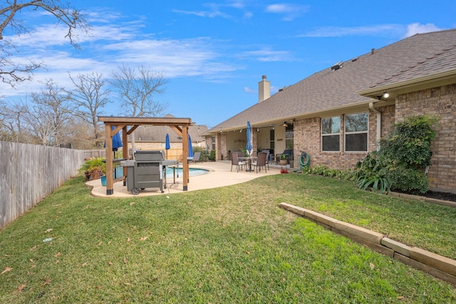 view of yard featuring a fenced in pool, a patio, and a fenced backyard