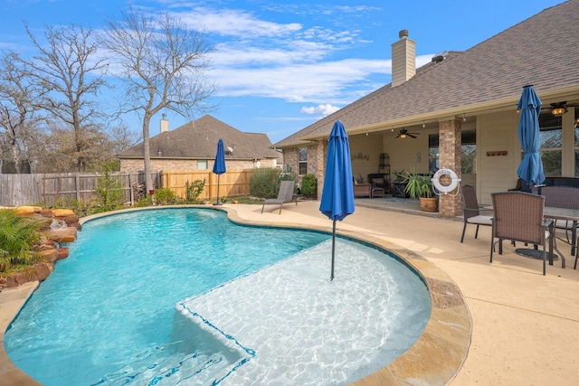 view of pool featuring ceiling fan and a patio area