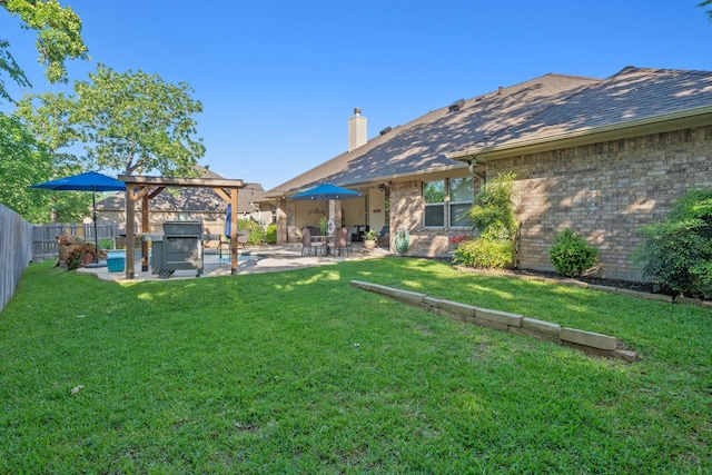 view of yard with a fenced backyard, a jacuzzi, a pergola, and a patio