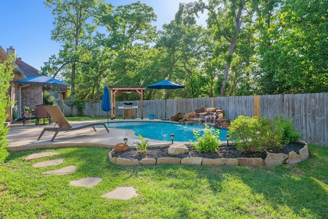 view of swimming pool with a yard, a fenced in pool, a patio, and a fenced backyard
