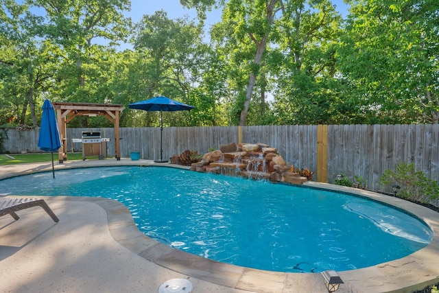 view of swimming pool with a patio area, a fenced backyard, and a fenced in pool