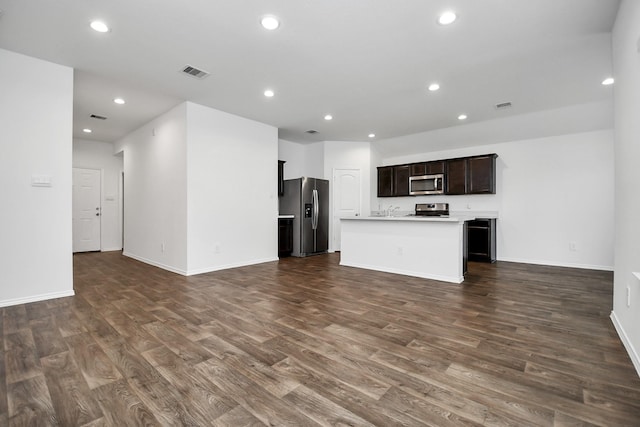 unfurnished living room with dark hardwood / wood-style floors