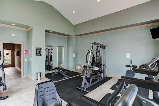 exercise room featuring high vaulted ceiling