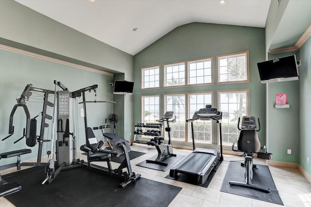 workout area featuring high vaulted ceiling and light tile patterned flooring