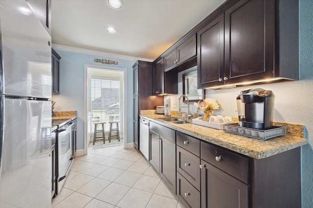 kitchen with crown molding, dark brown cabinets, sink, light tile patterned flooring, and stainless steel appliances