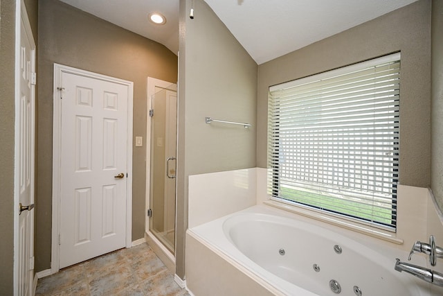 bathroom with shower with separate bathtub and lofted ceiling