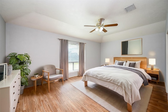 bedroom with ceiling fan and light wood-type flooring