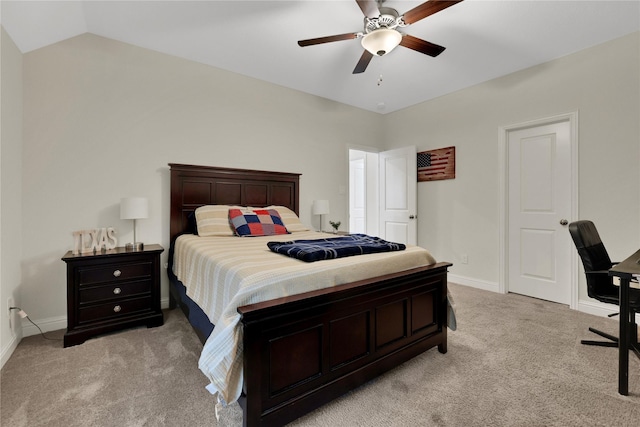 carpeted bedroom featuring ceiling fan and vaulted ceiling