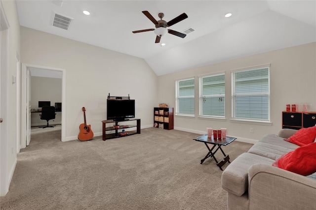 living room featuring ceiling fan, light carpet, and vaulted ceiling