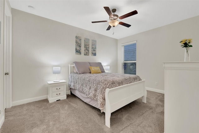 bedroom with ceiling fan and carpet flooring