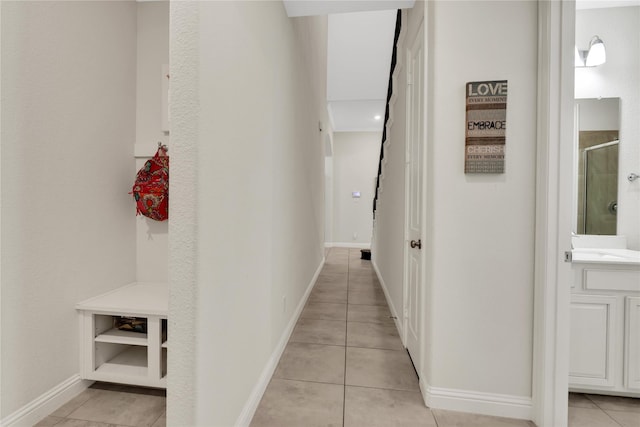 hallway featuring light tile patterned flooring