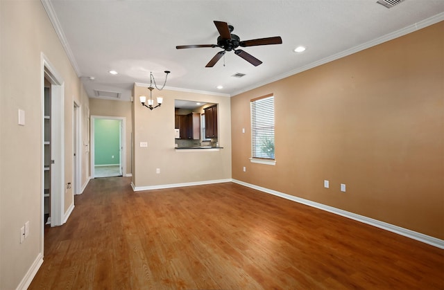 unfurnished living room with wood-type flooring, ceiling fan, and crown molding