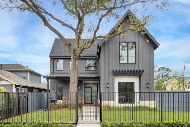 modern farmhouse style home with a front yard