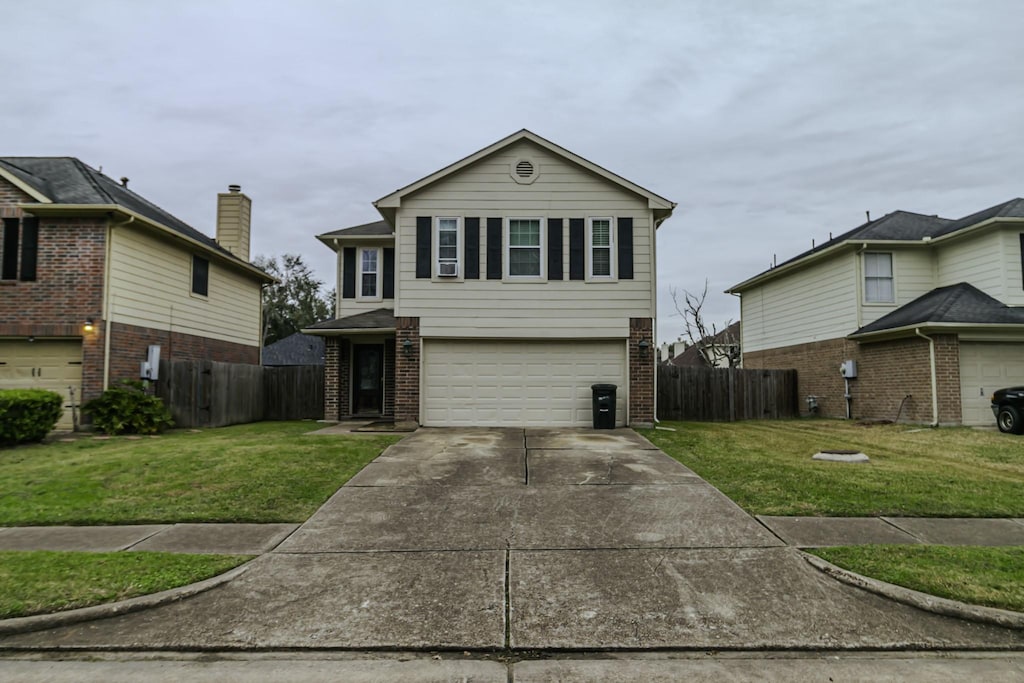 view of front property with a garage and a front lawn