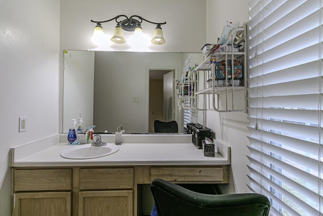 bathroom with vanity and a healthy amount of sunlight