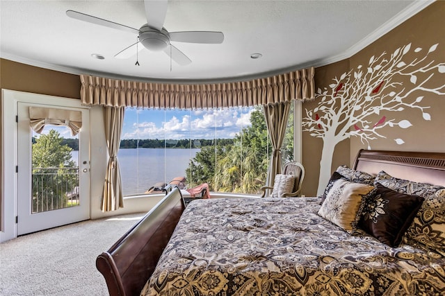 carpeted bedroom with ceiling fan, crown molding, access to outside, and a water view