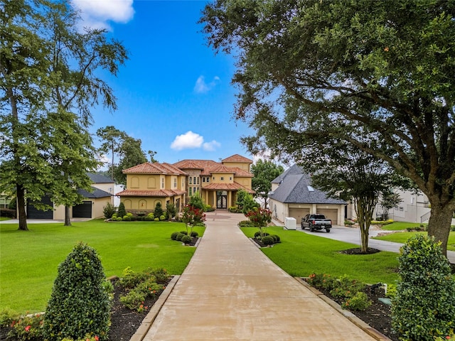 view of front facade featuring a front yard and a garage