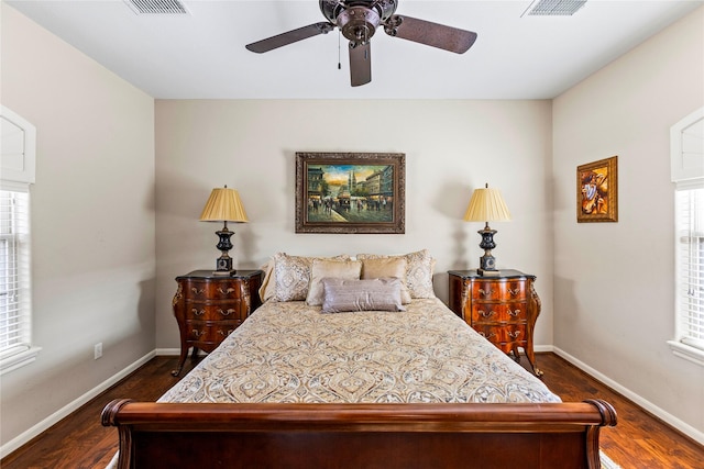 bedroom featuring ceiling fan and dark hardwood / wood-style floors