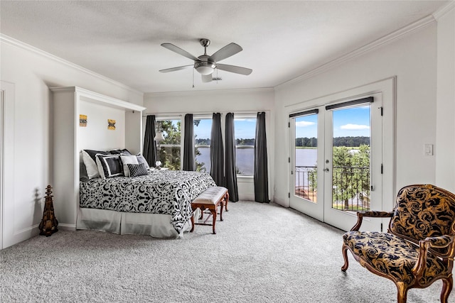 bedroom featuring a water view, carpet, ornamental molding, access to outside, and ceiling fan