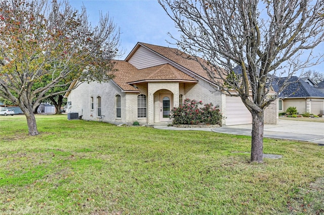 view of front of property featuring a front yard, central AC, and a garage