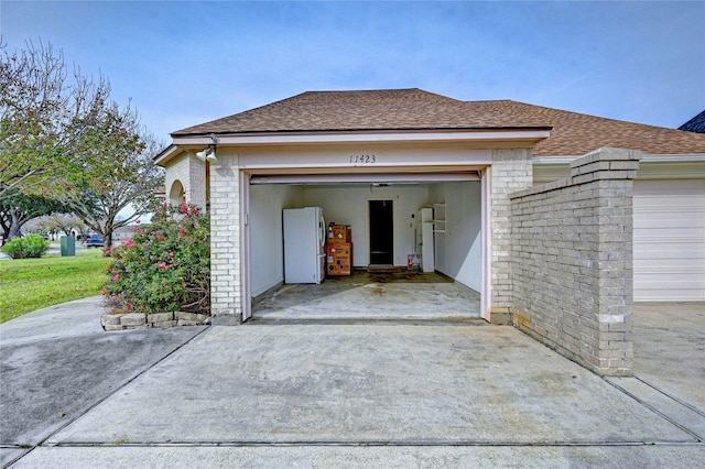 garage featuring fridge