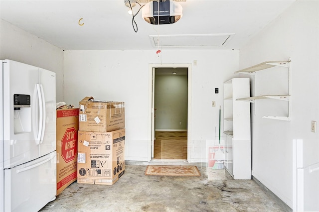 garage with white fridge with ice dispenser and a garage door opener