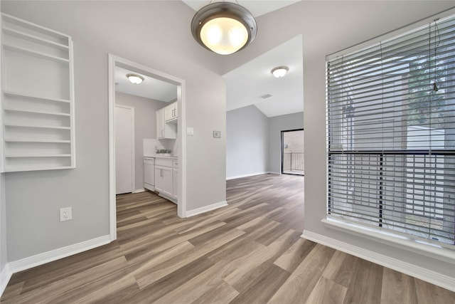 corridor featuring light hardwood / wood-style floors